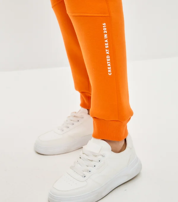 Джоггеры с начесом оранжевые